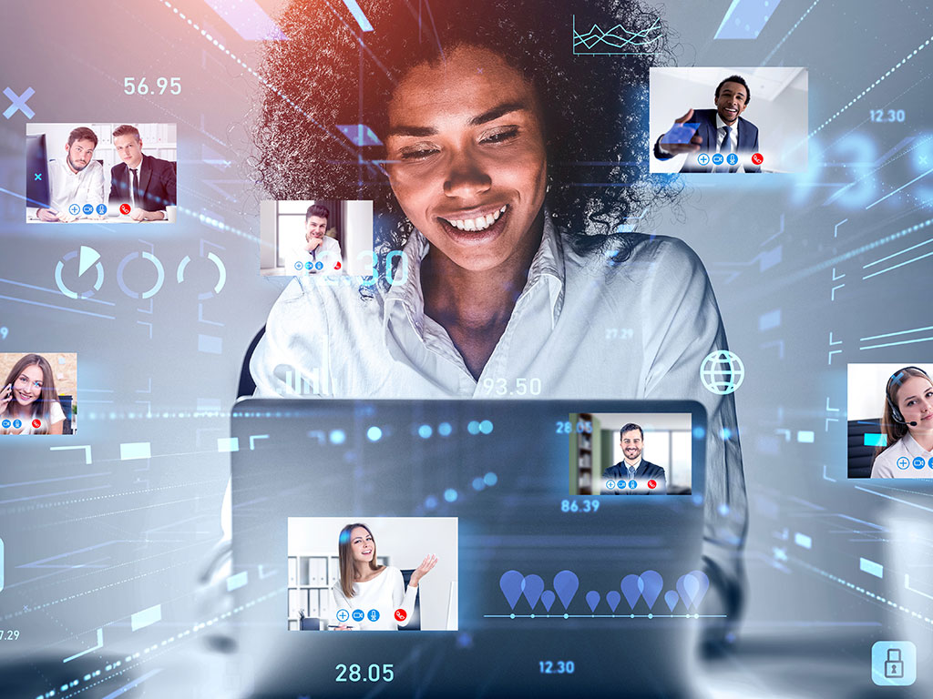 Attractive African American businesswoman using laptop to be a part of video conference call, business colleagues, a team communicating on the distance, hologram digital interface