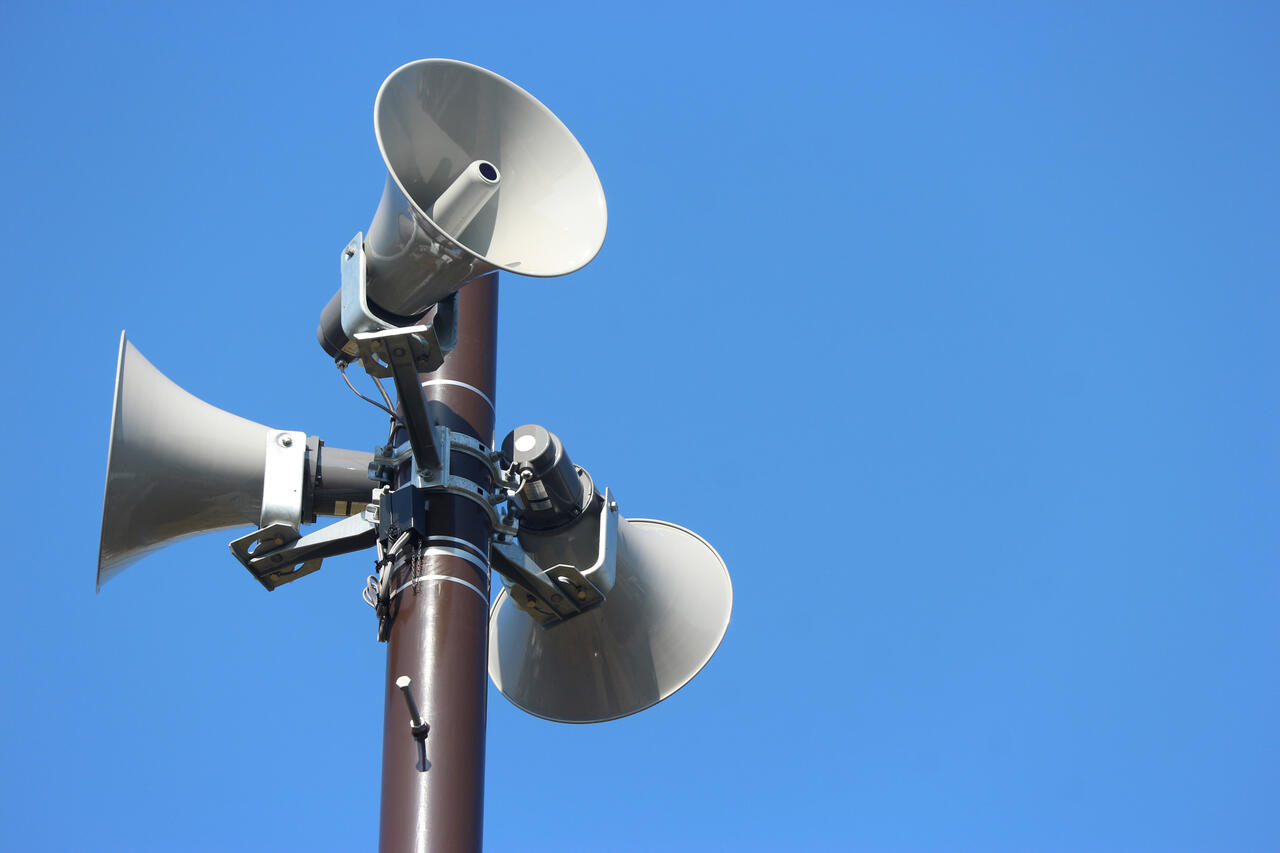 security speakers tower for warning or announce with clear blue sky background